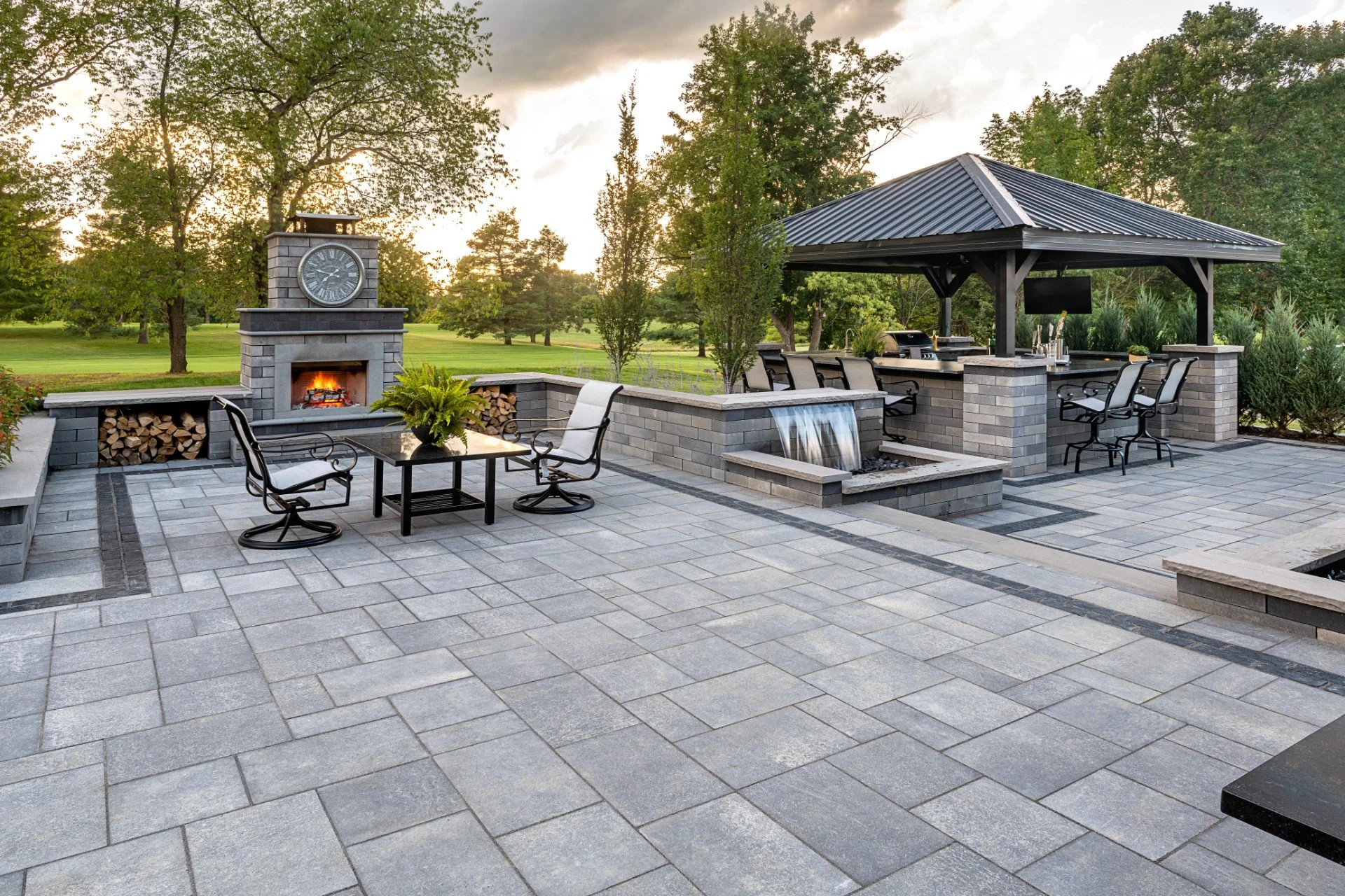 Natural stone outdoor living space overlooking the coast